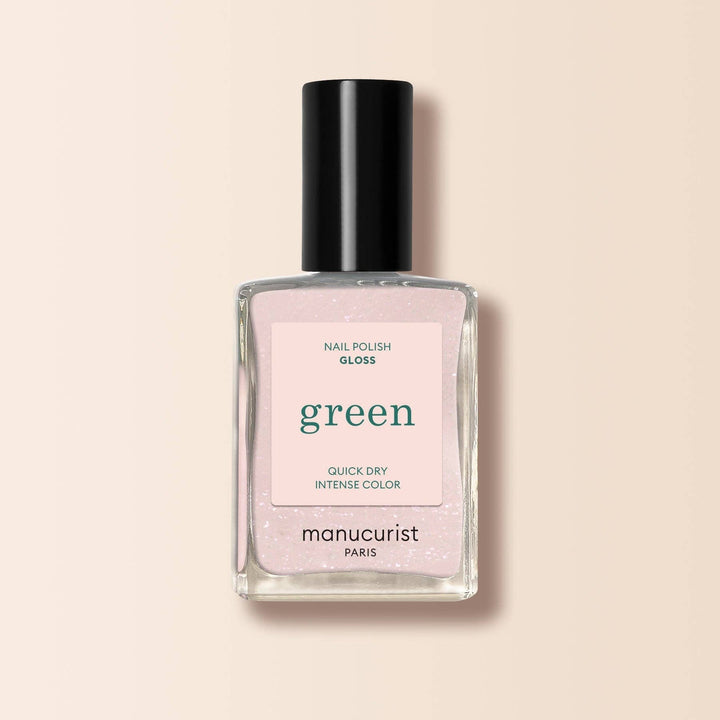 Manucurist nail polish bottle with pink label on a beige background