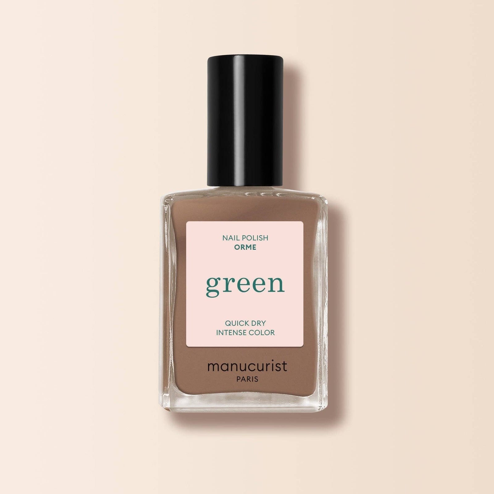 Manucurist nail polish bottle with a on a beige background