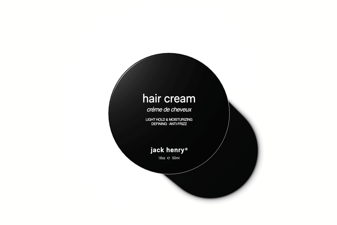 Black container of Jack Henry hair cream on a white background