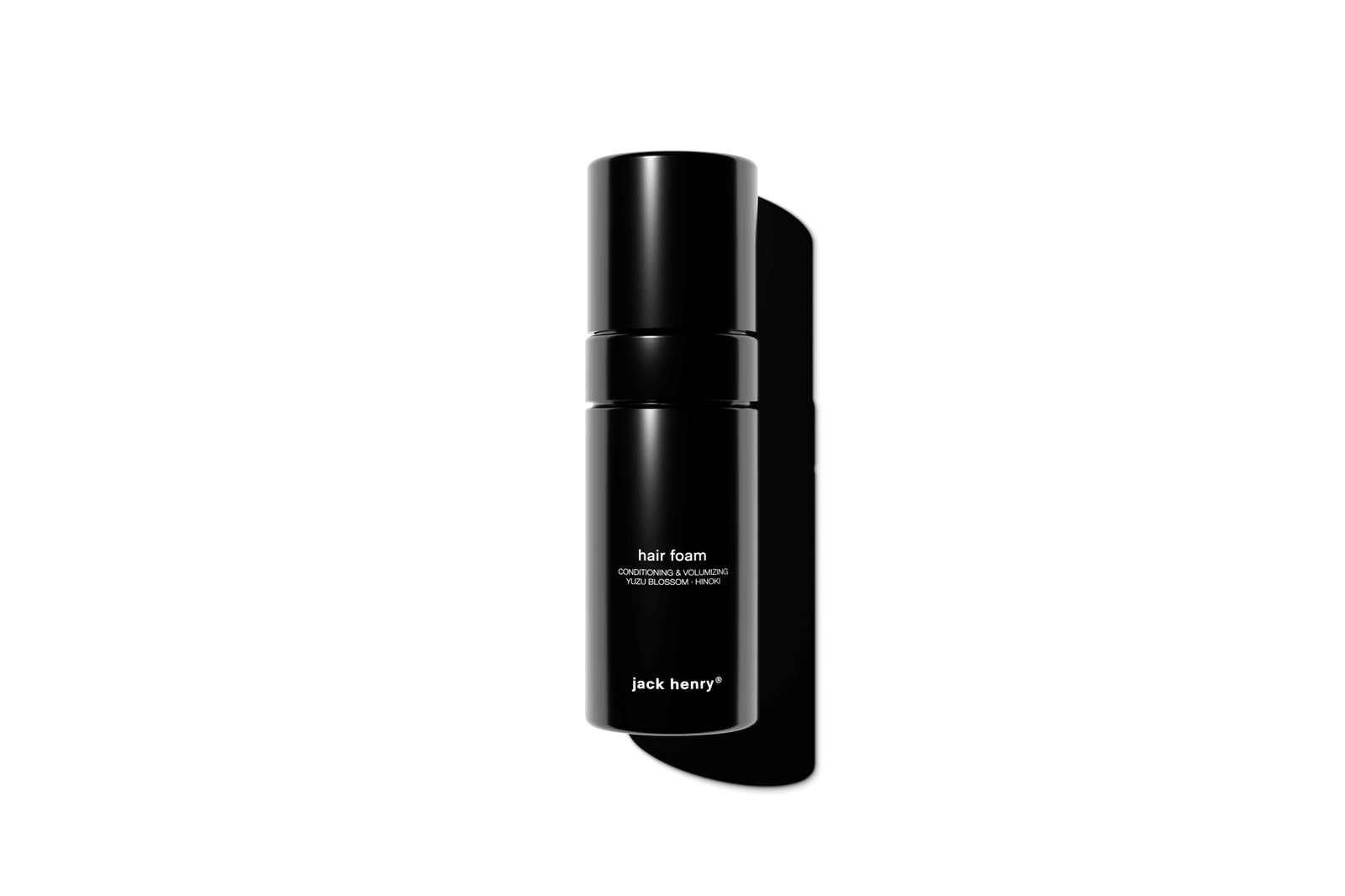 Black hair foam bottle with 'jack henry' branding on a white background