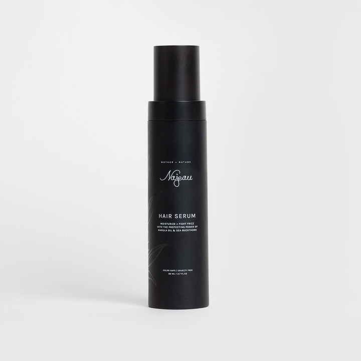 Black hair serum bottle with white text on a light gray background