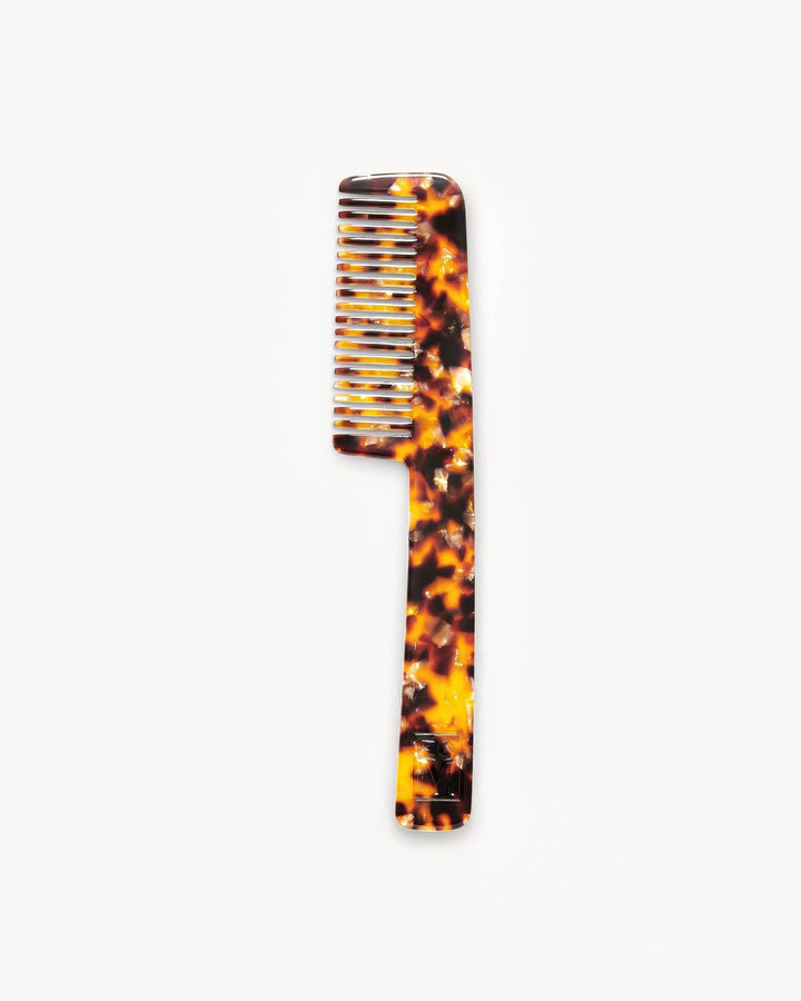Moeru Gojira-patterned handle comb on a white background