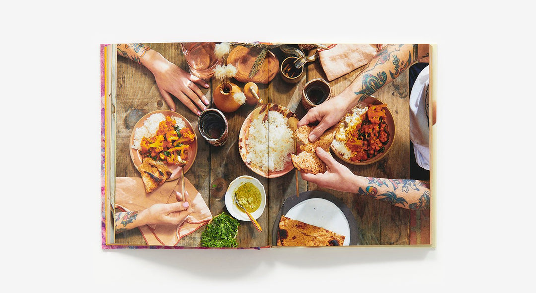 People enjoying a meal together with various dishes on a table