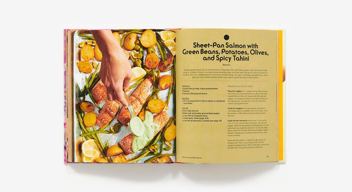 Open cookbook showing a recipe for Sheet-Pan Salmon with Vegetables
