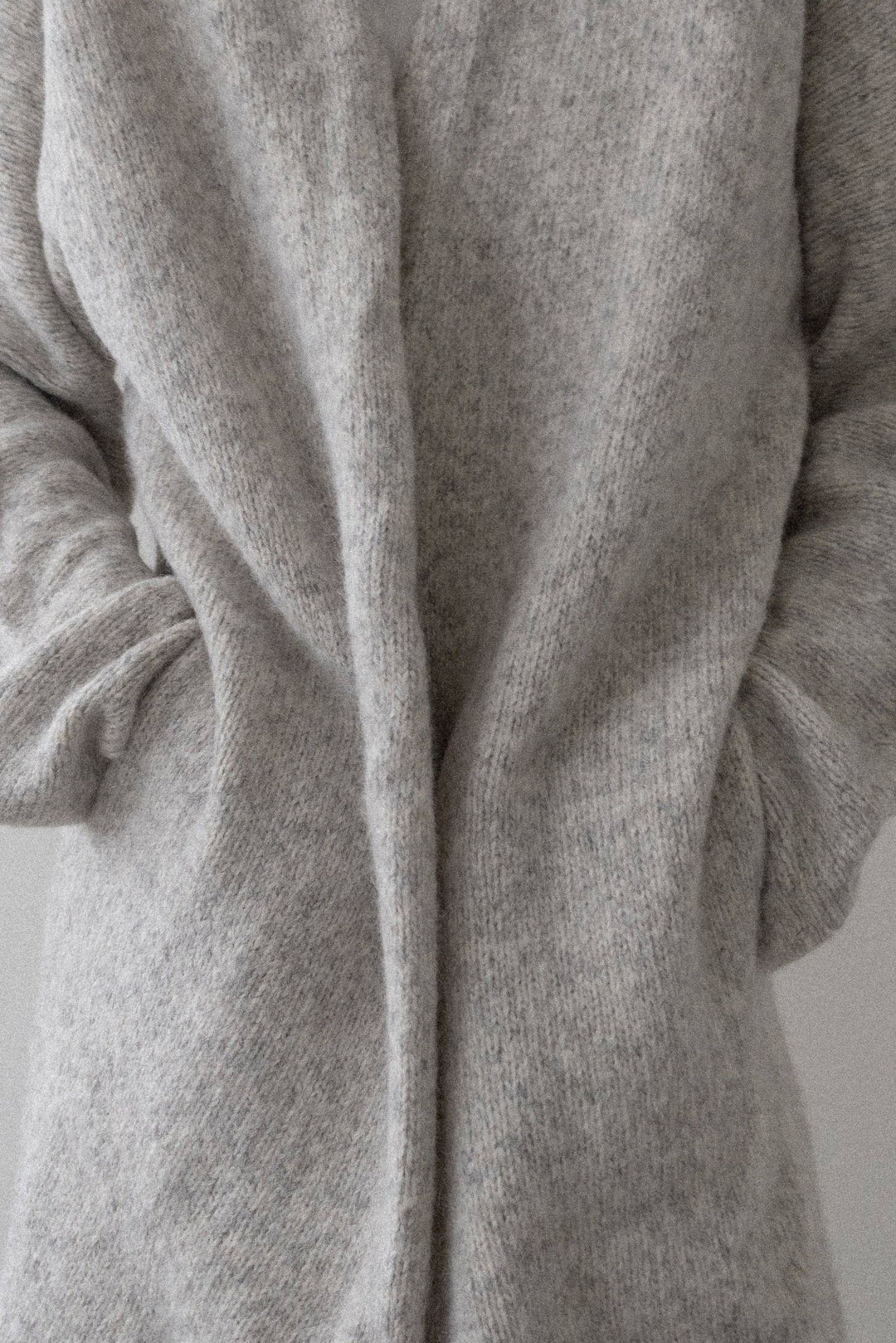 Heirloom Sweater Coat in Cloud by a person on a plain background