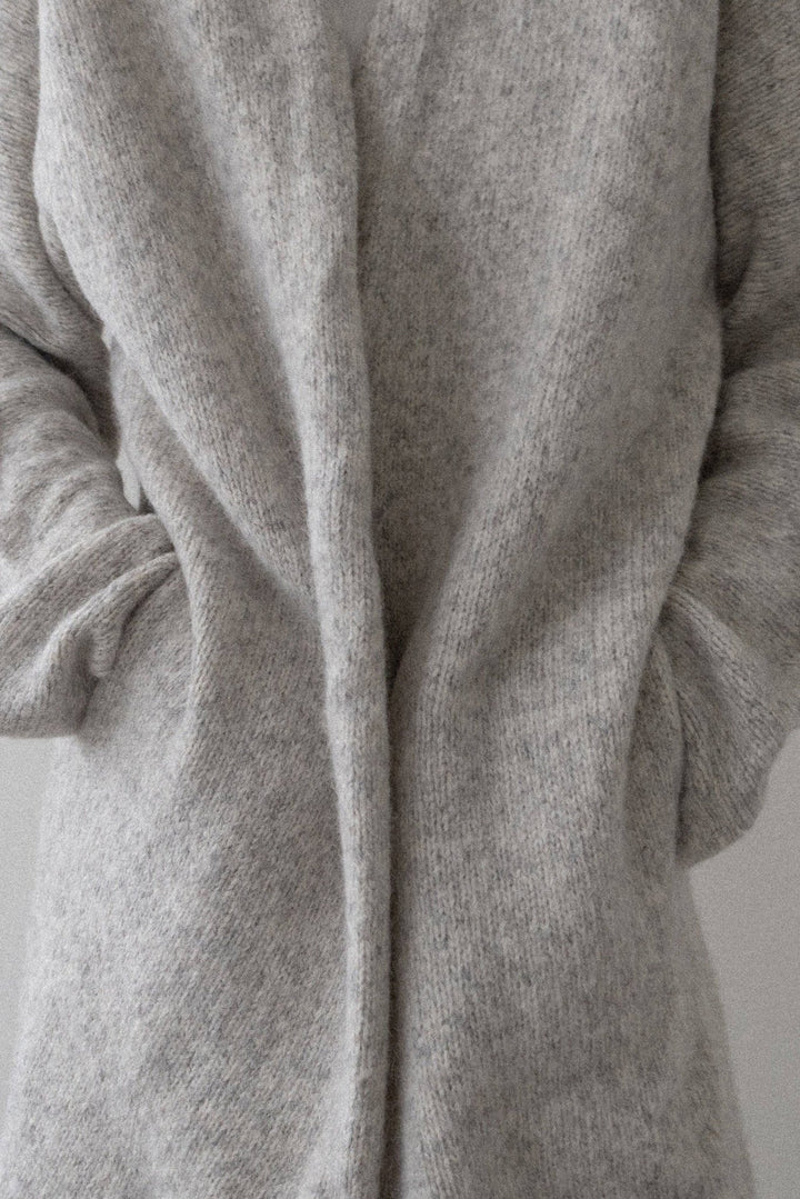 Heirloom Sweater Coat in Cloud by a person on a plain background