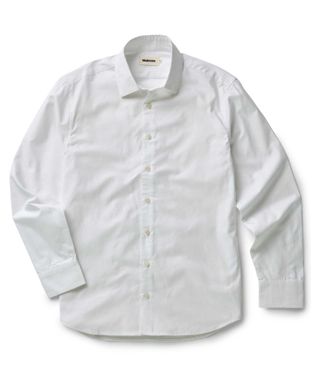 white dress shirt on white background, flat lay.