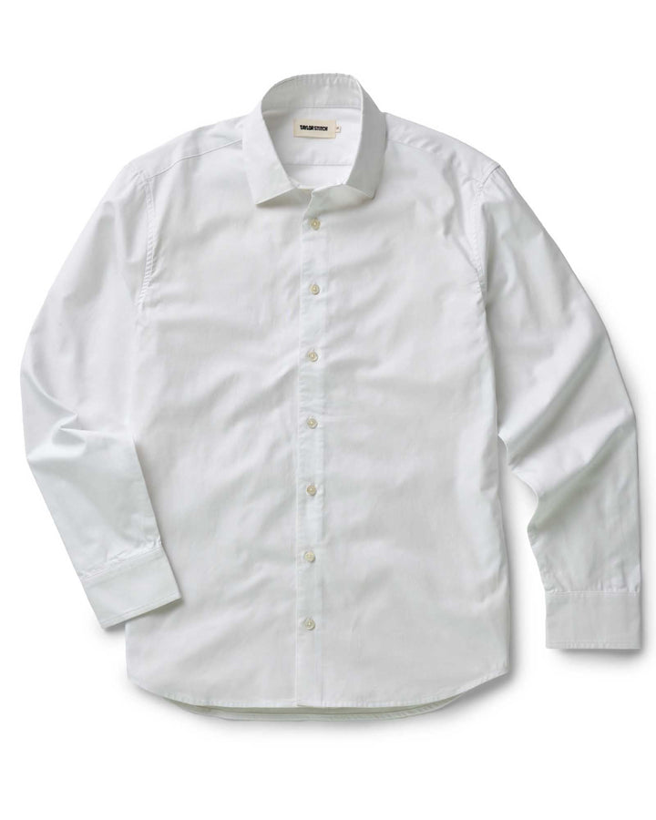 white dress shirt on white background, flat lay.
