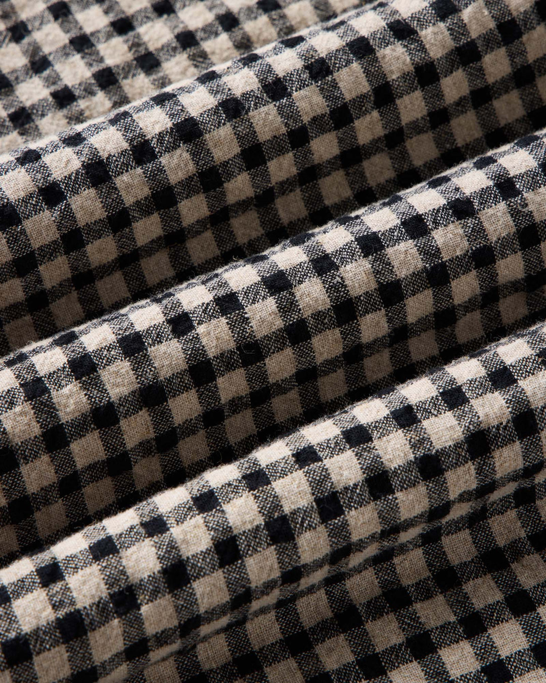 A close-up of breaker ginham fabric.