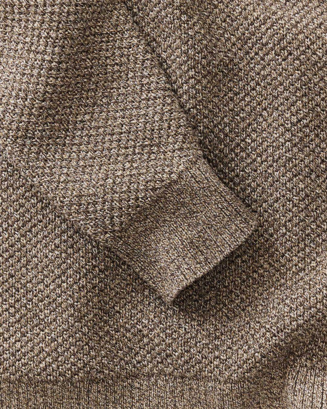 Close-up of the Crawford Crew Sweater in coffee twist showing the detailed fabric weave and ribbed cuff.
