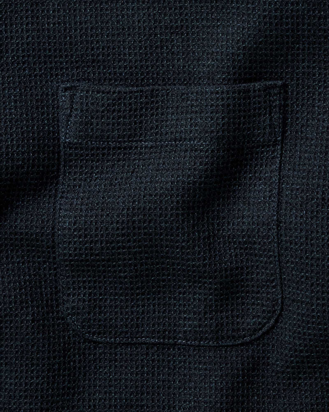 Close-up of The Jack Shirt in Forest Waffle with a stitched rectangular pocket.