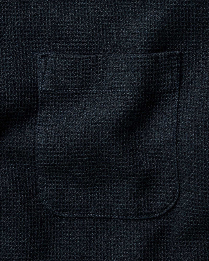 Close-up of The Jack Shirt in Forest Waffle with a stitched rectangular pocket.