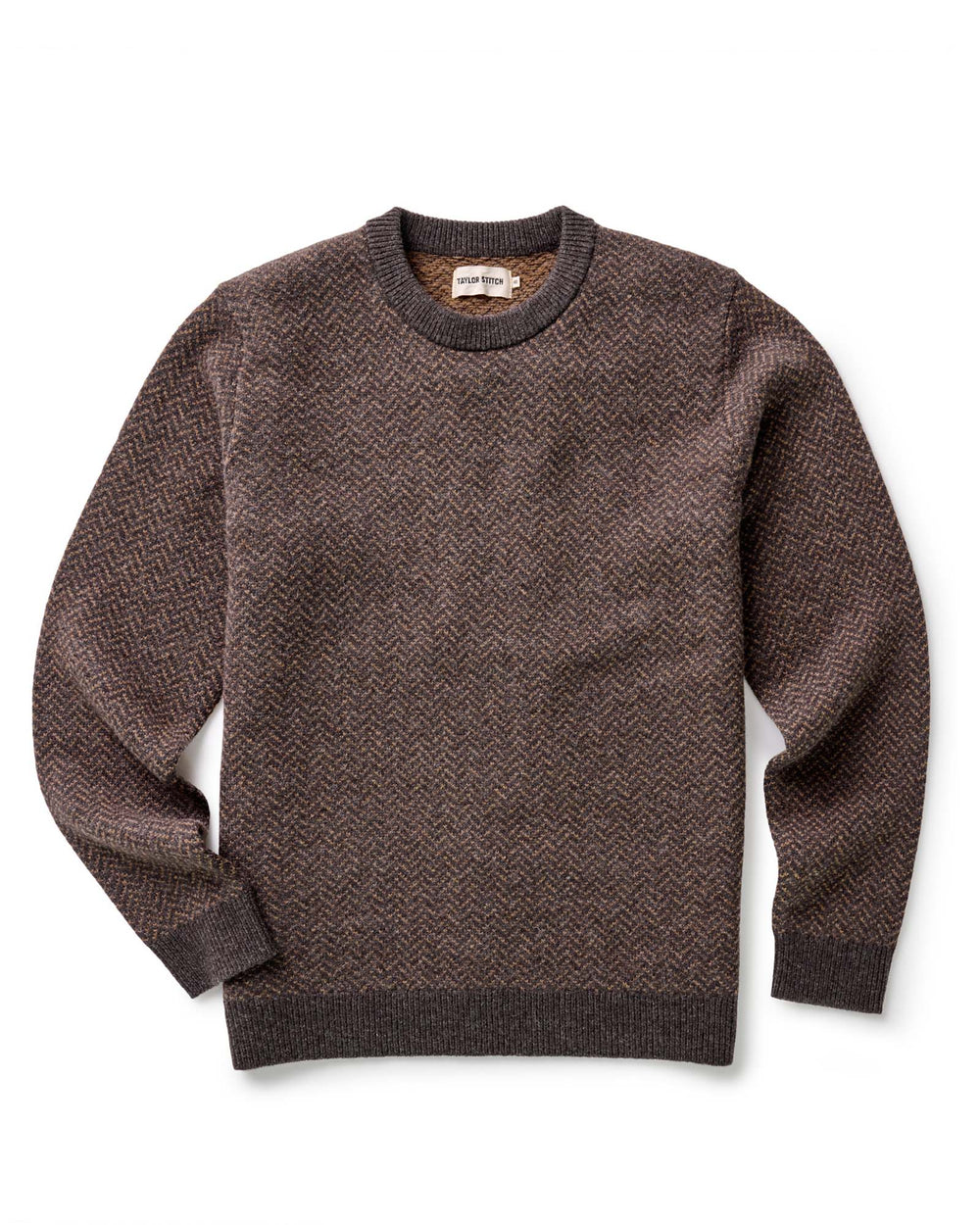 Brown patterned sweater on a white background
