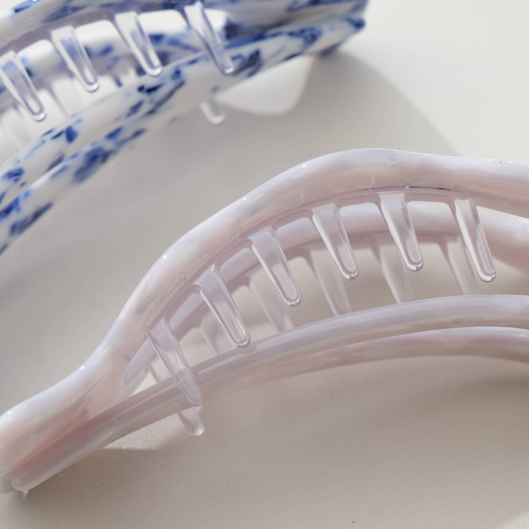 Close-up of an ivory hair clip on a white background
