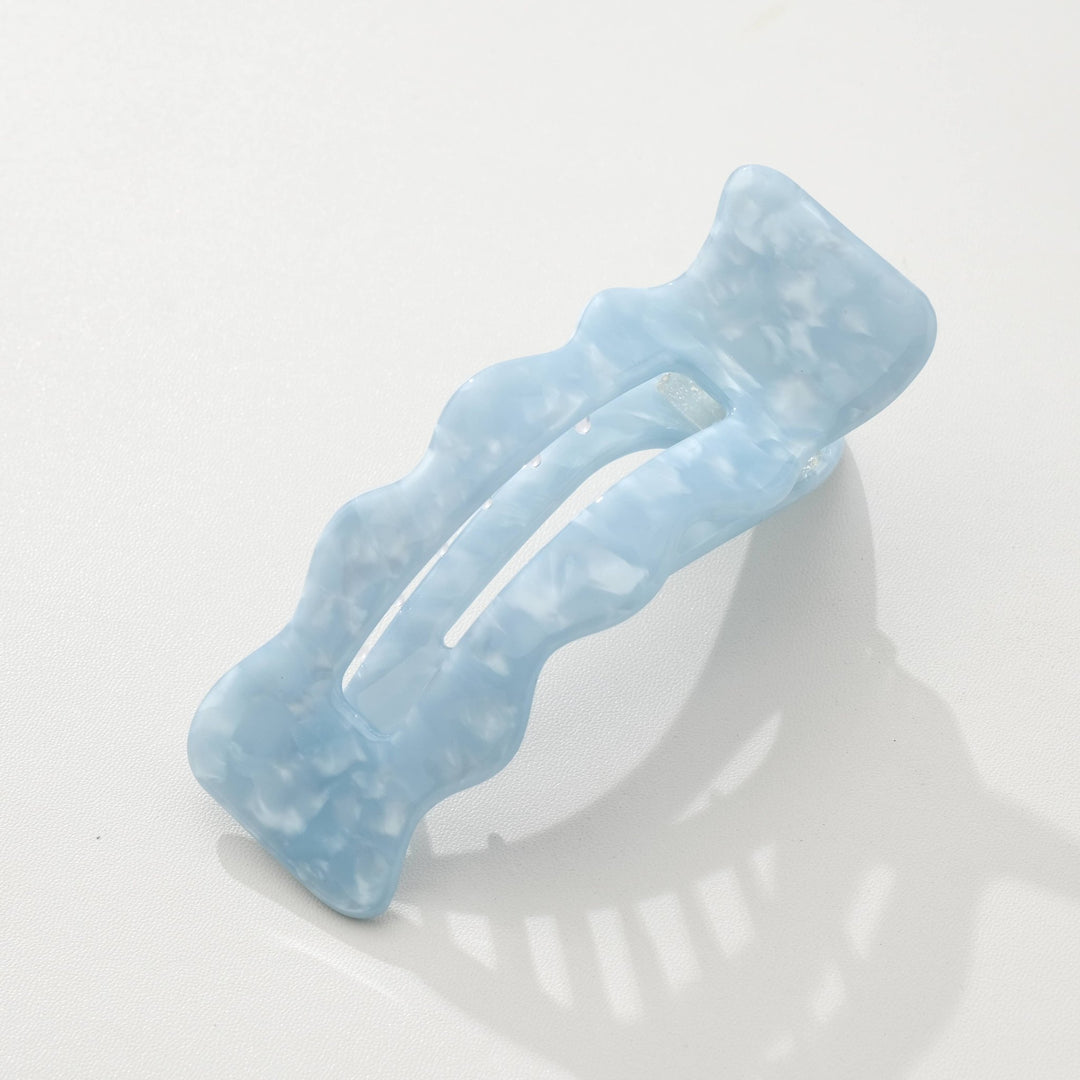 Saltwater blue hair clip on a white background