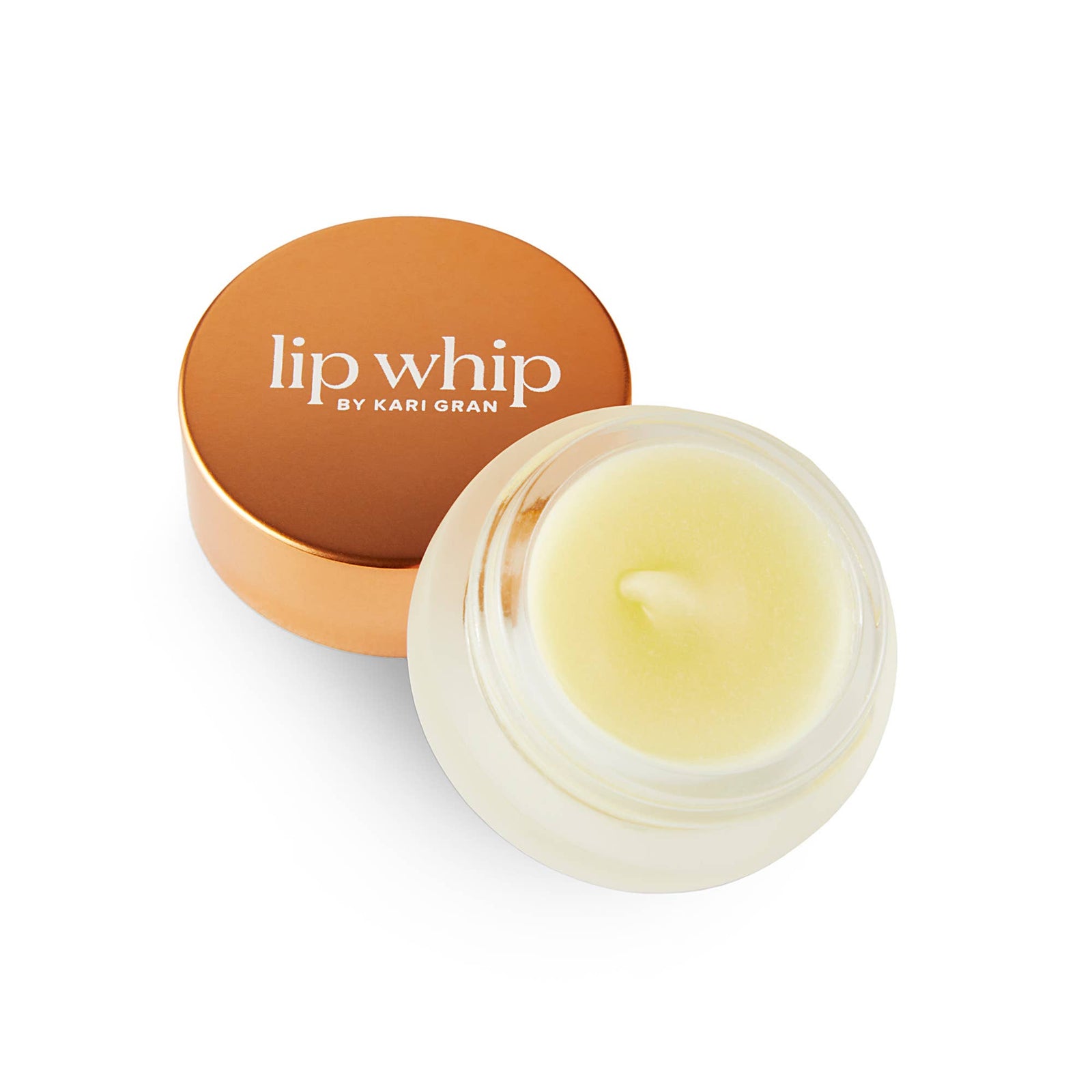 Lip balm container with 'lip whip by Kari Gran' on a white background