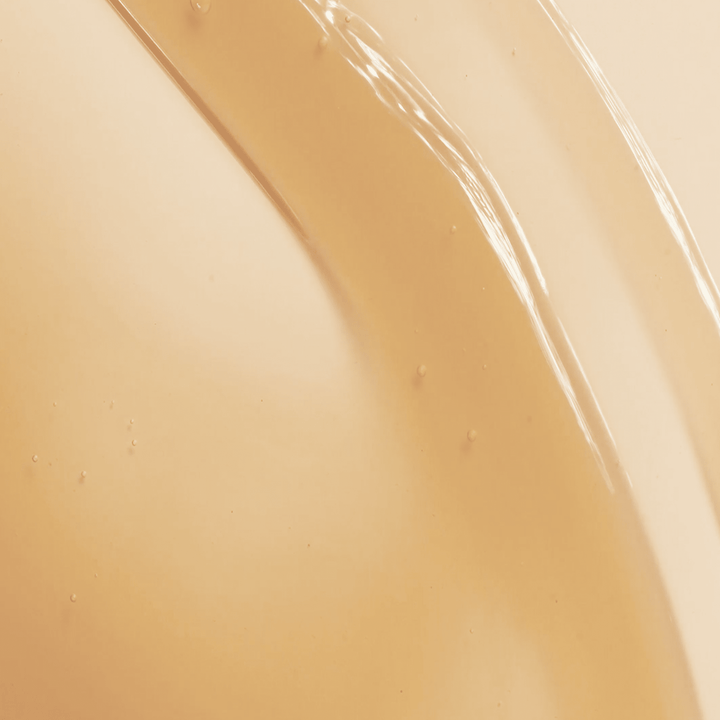 Close-up of lip oil with glossy texture