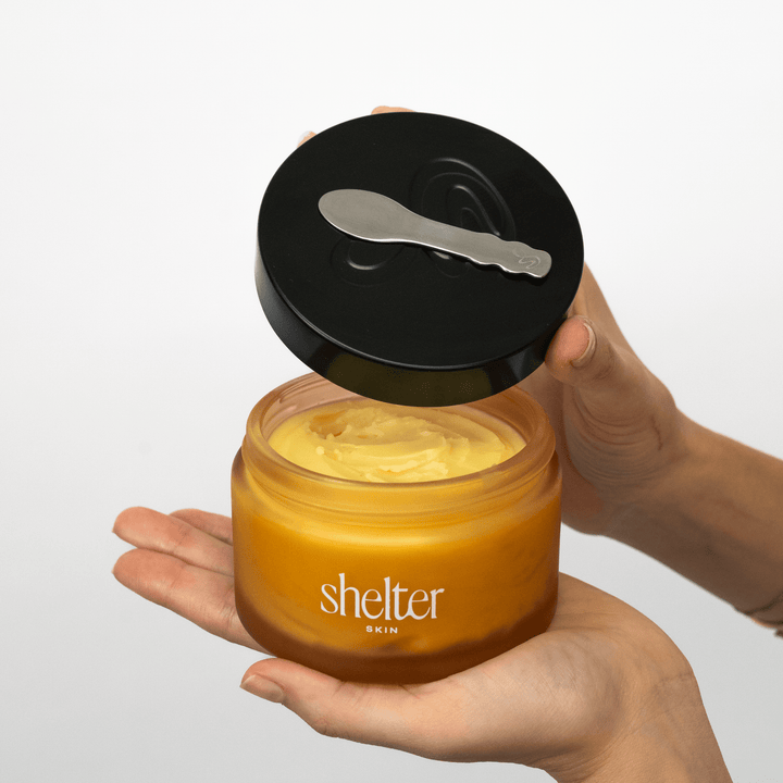 No. 1 Solar Tallow Body Butter with its lide that holds a product spoon against a plain white background.