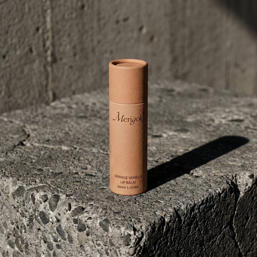 Lip balm tube labeled &