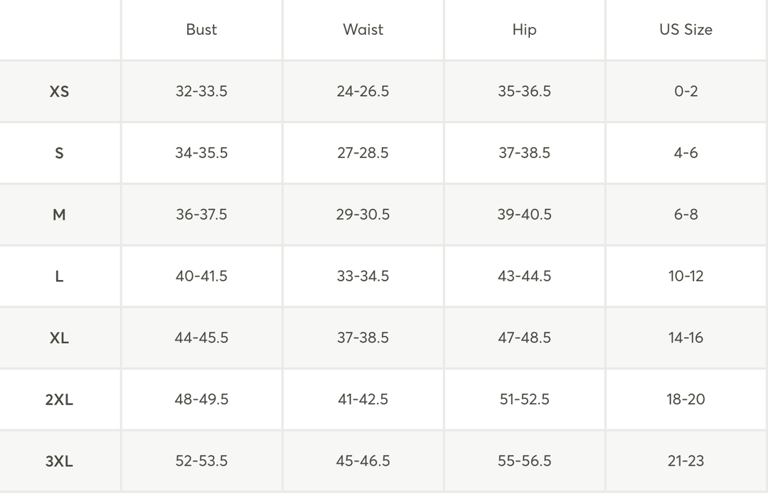 A size chart table with columns for Bust, Waist, Hip, and US Size, listingXS through 3XL sizes in a clean grid format.