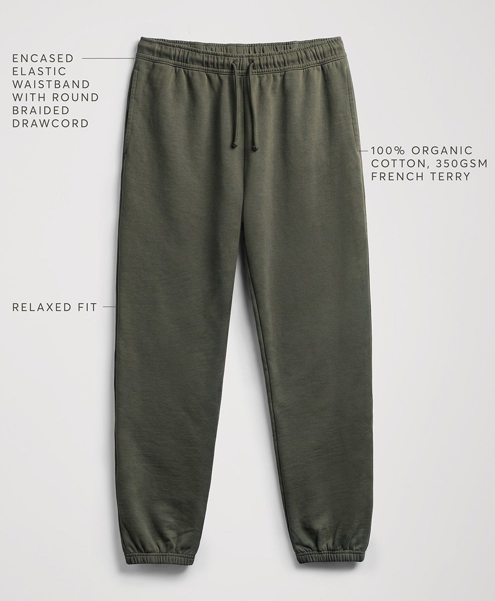 Pact dusted green relaxed-fit sweatpants with a drawstring waistband, shown on a light gray background with text callouts describing features and fabric.