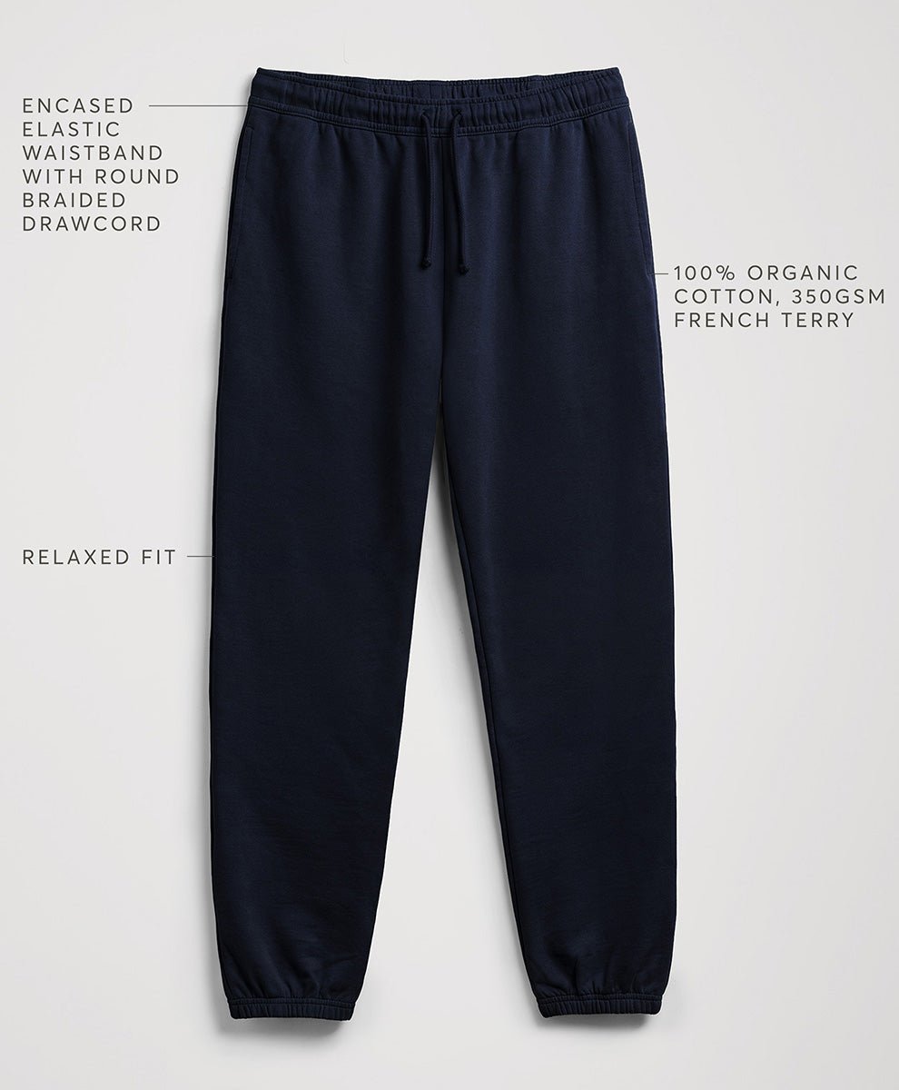 Navy blue jogger sweatpants with text callouts highlighting features like the enclosed elastic waistband, relaxed fit, and cotton fabric, shown on a light gray background.