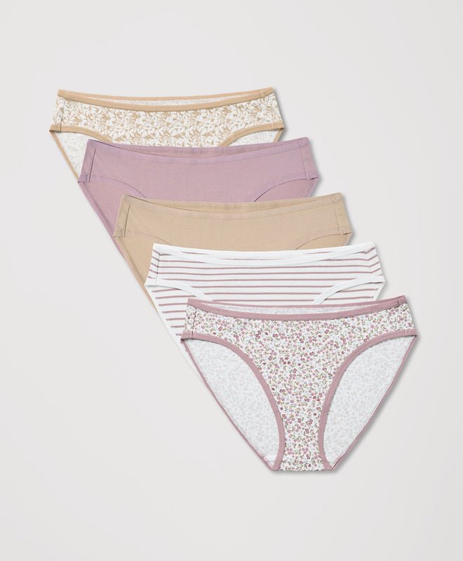 Set of four women's underwear with different patterns on a light gray background