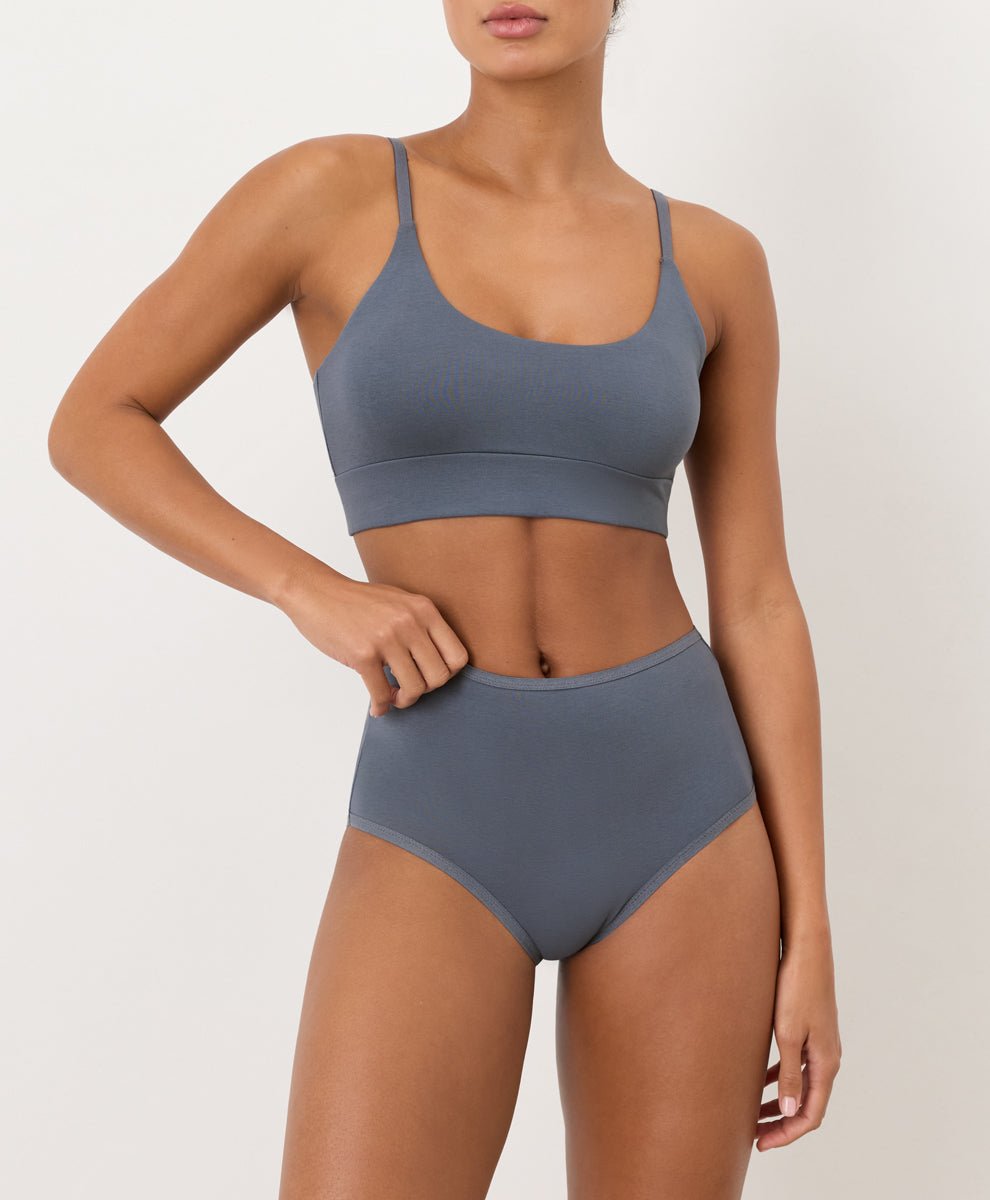 Smoke Blue high-waisted underwear and T-Shirt Bra worn by a person on a plain background