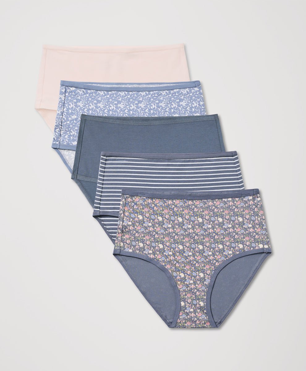 Set of women's underwear with floral and striped patterns on a light gray background