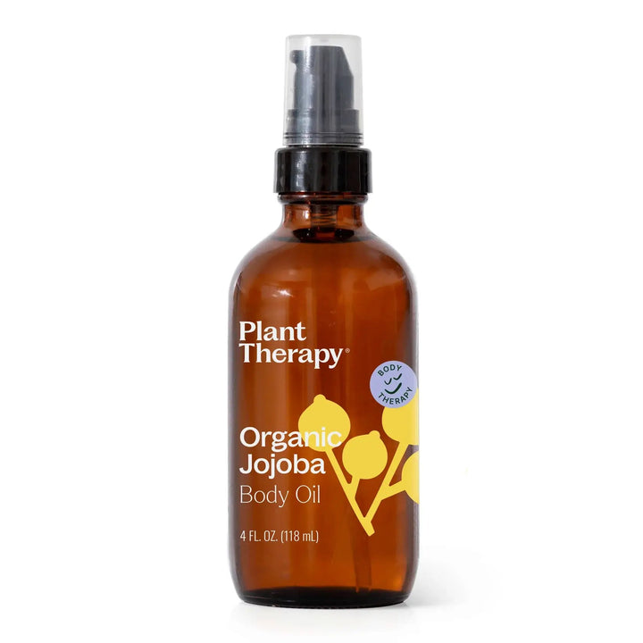 Brown glass bottle of Plant Therapy Organic Jojoba Body Oil on a white background