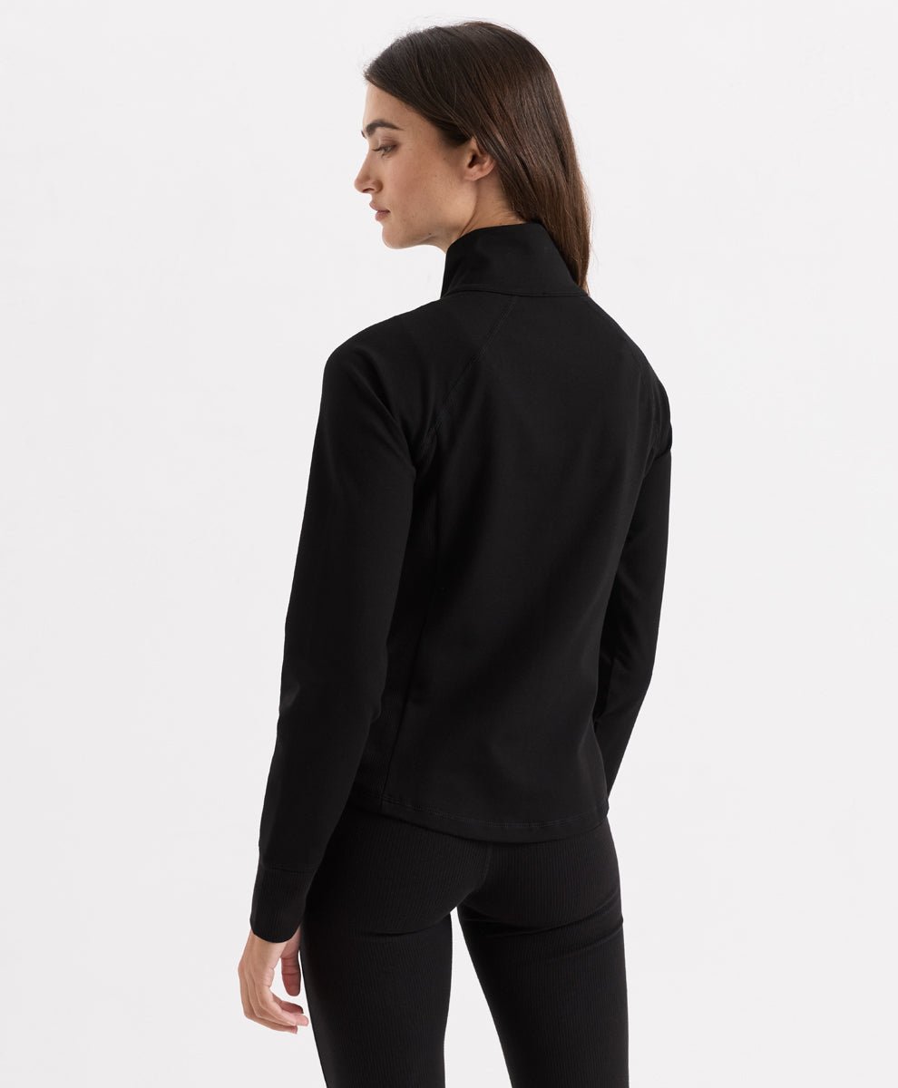 A woman shown from the back wearing Pact&