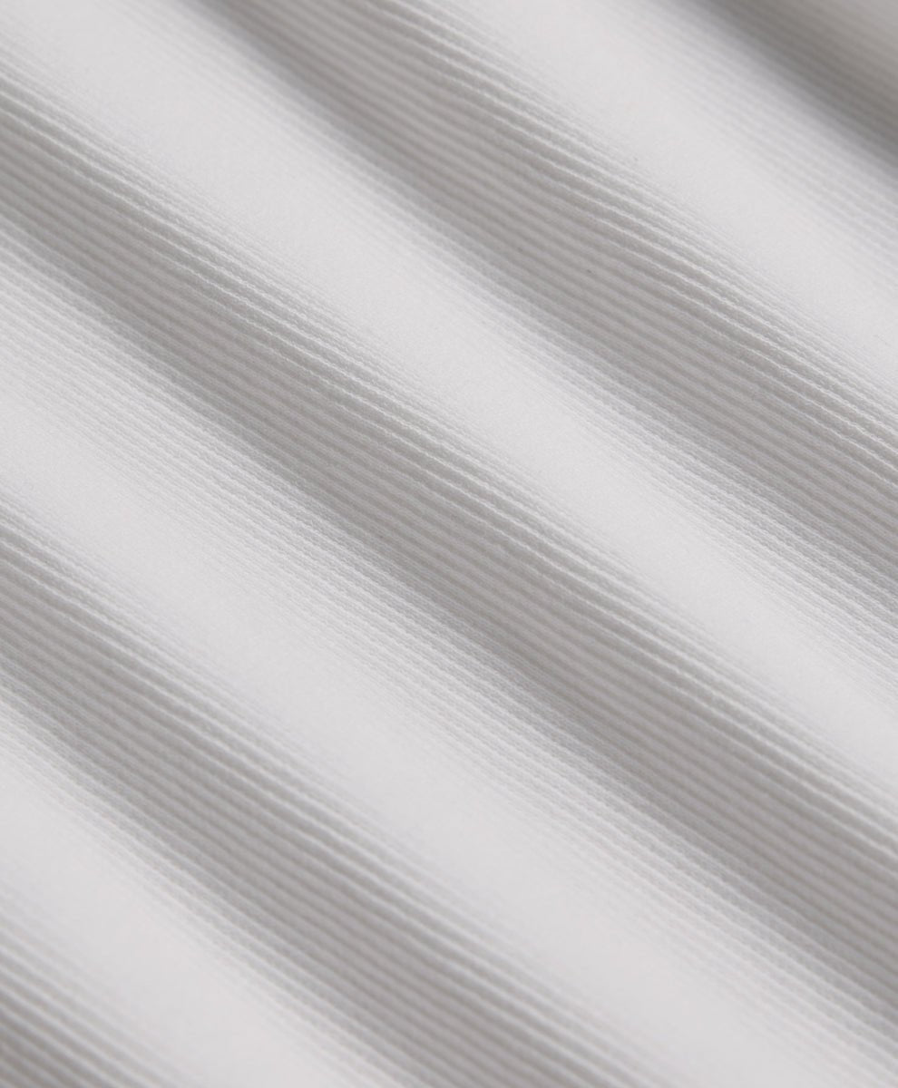 Close-up of textured rib white fabric.