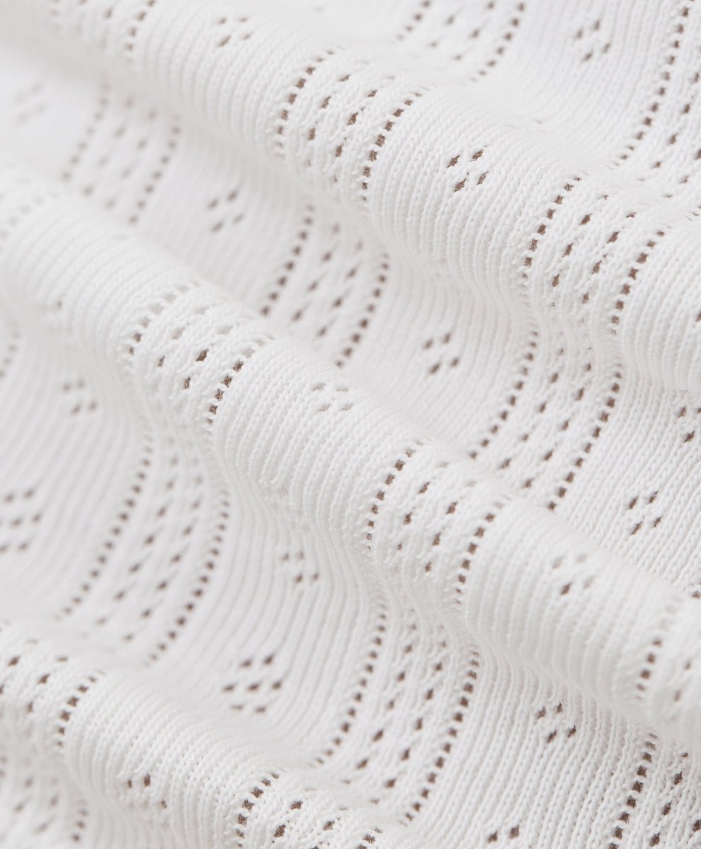Close-up of a pointelle white fabric.