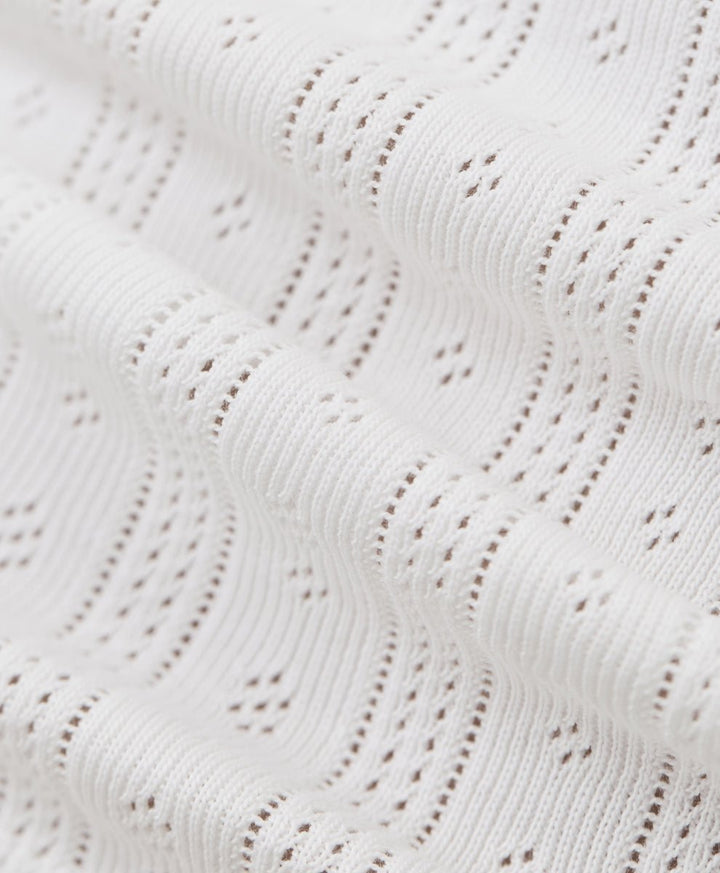Close-up of a pointelle white fabric.