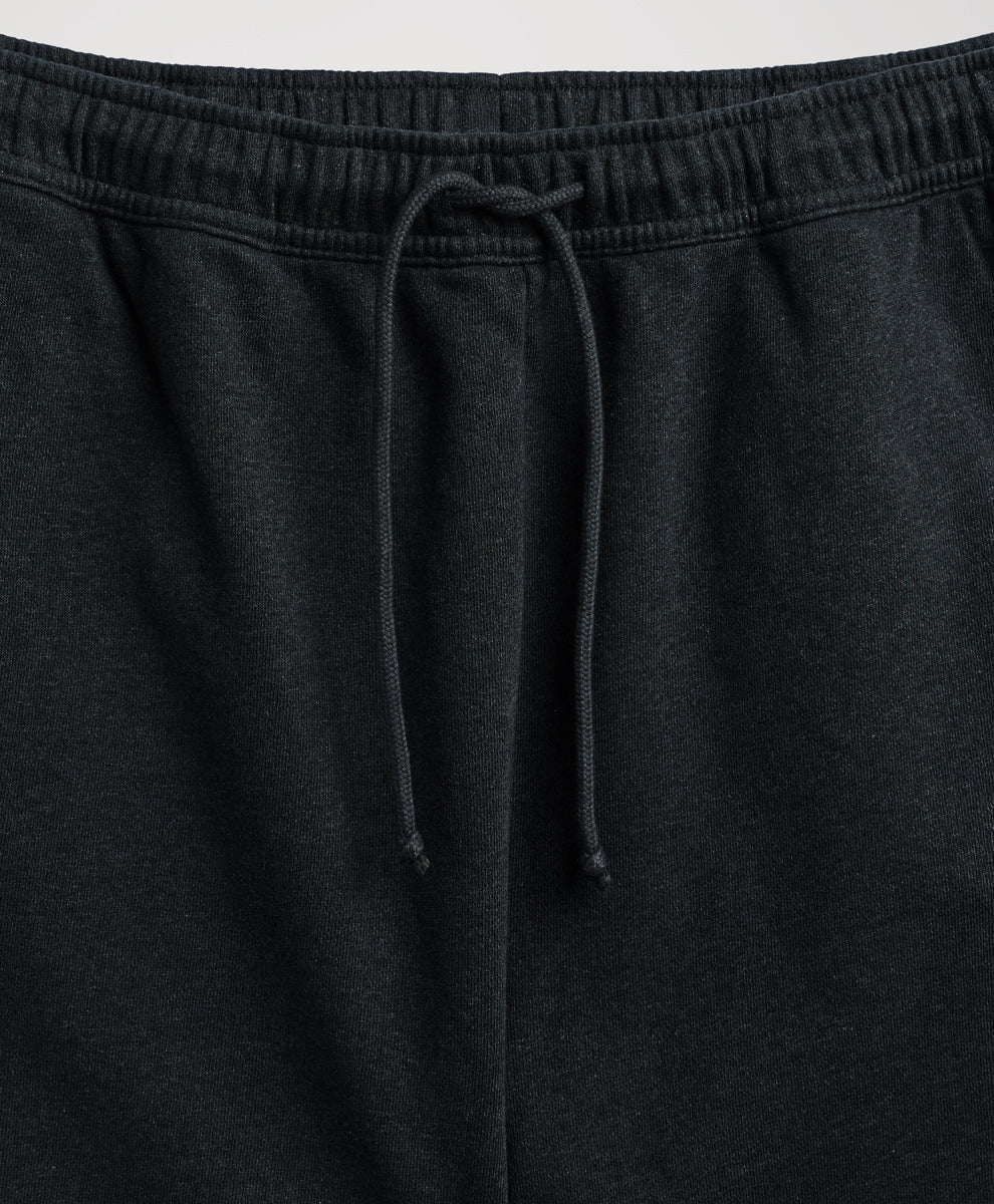 Close-up of pact charcoal heather sweatpants showing the elastic waistband and matching drawstring.