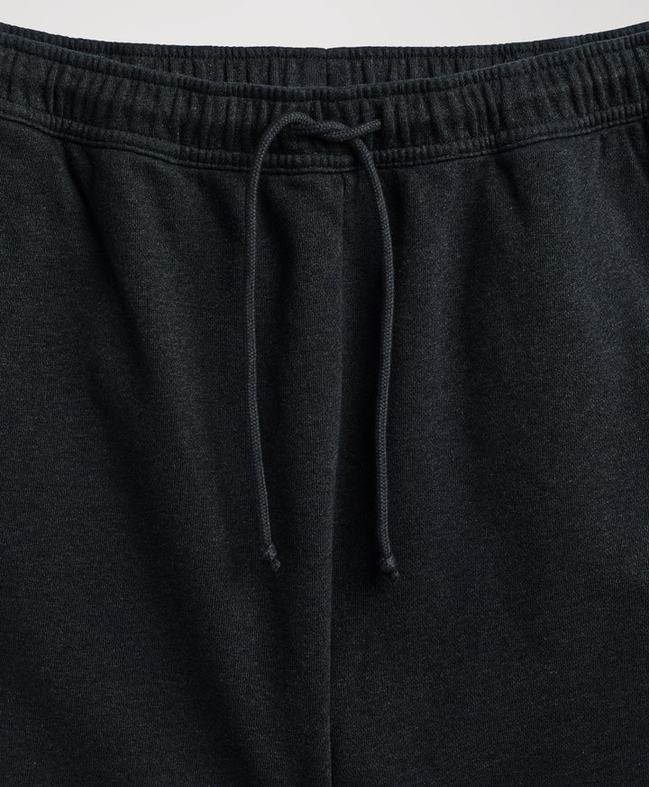 Close-up of pact charcoal heather sweatpants showing the elastic waistband and matching drawstring.