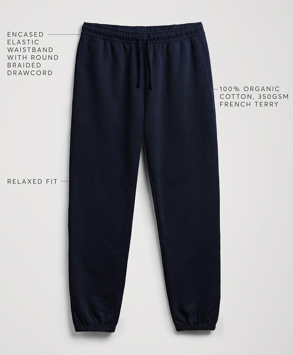Navy blue jogger sweatpants with text callouts highlighting features like the enclosed elastic waistband, relaxed fit, and cotton fabric, shown on a light gray background.