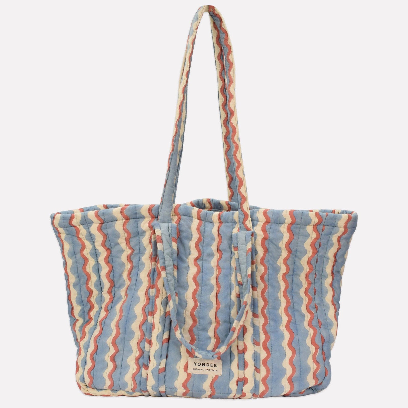 Yonder Quilted Carry All | Wiggle | Sky Striped tote bag with a visible brand logo on a light gray background