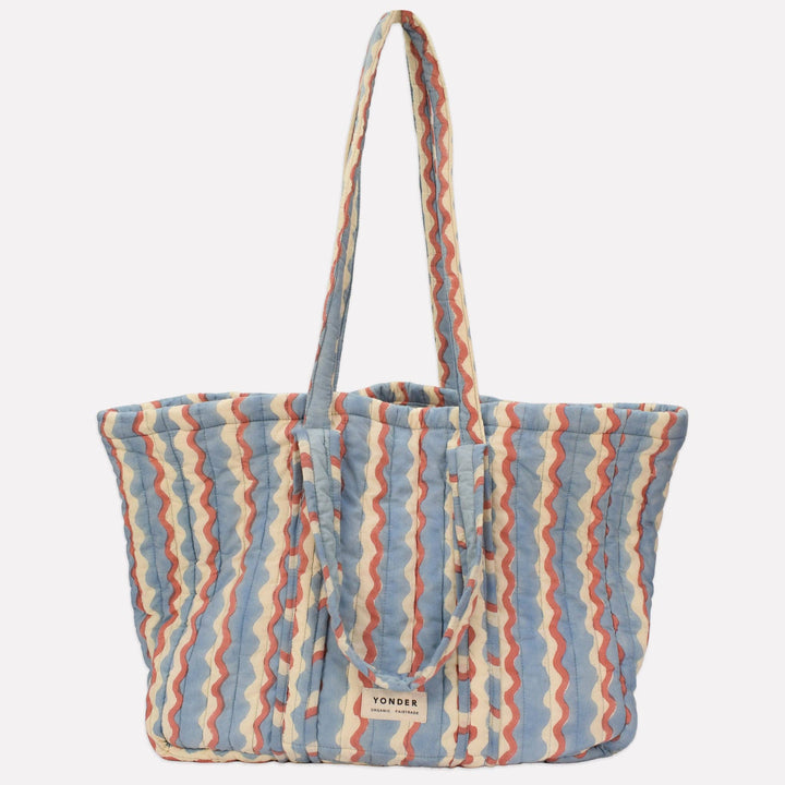 Yonder Quilted Carry All | Wiggle | Sky Striped tote bag with a visible brand logo on a light gray background