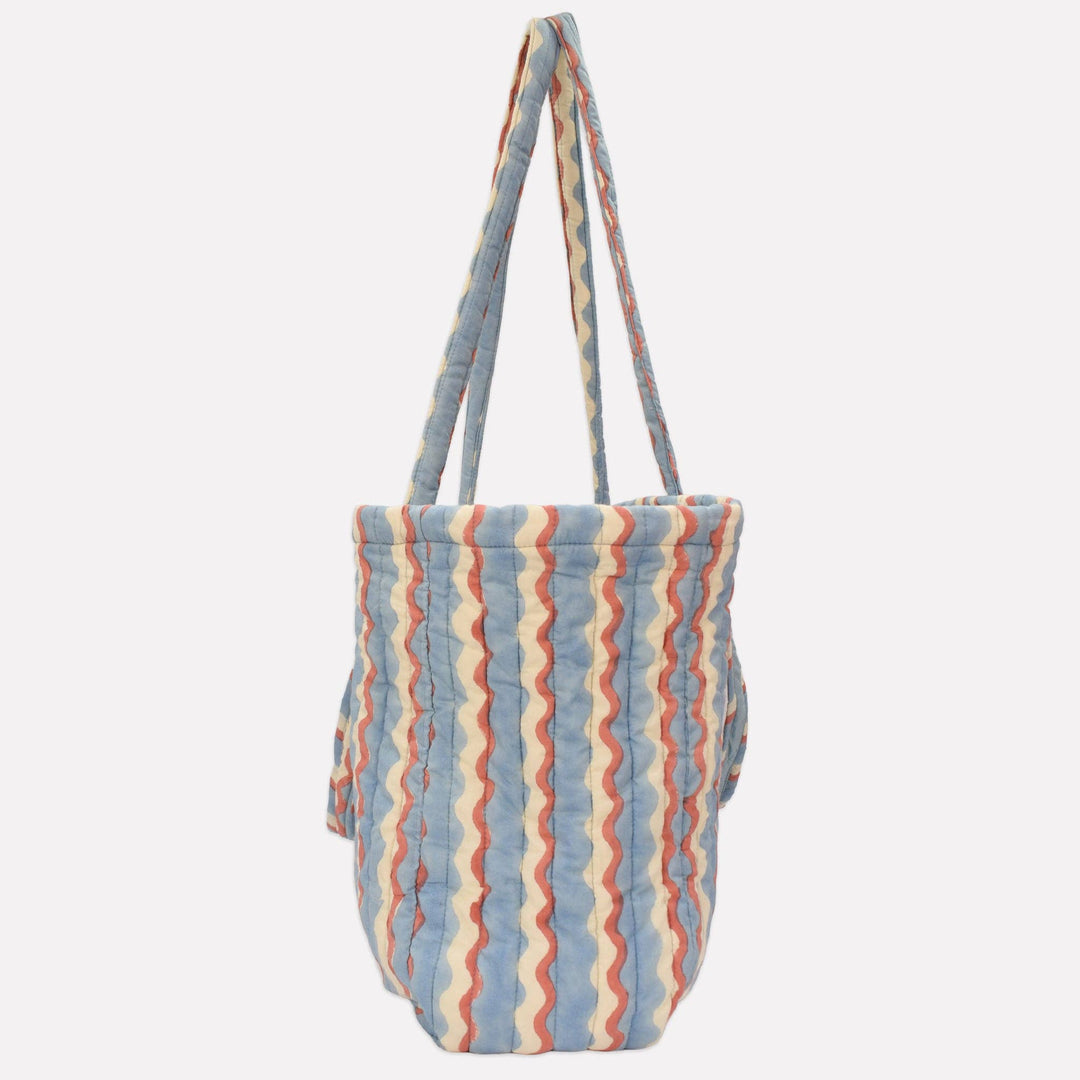 Yonder Quilted Carry All | Wiggle | Sky Striped tote bag with a visible brand logo on a light gray background