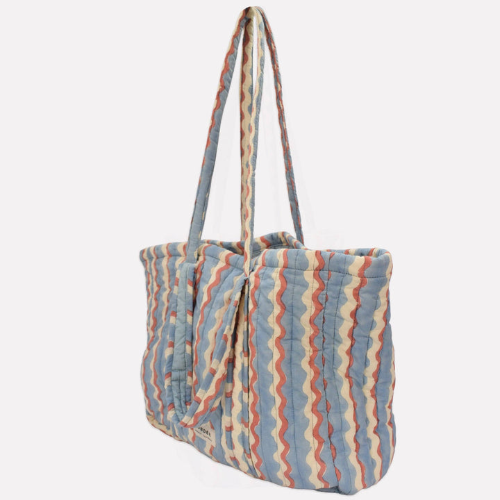 Yonder Quilted Carry All | Wiggle | Sky Striped tote bag with a visible brand logo on a light gray background