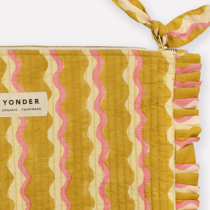 Patterned pouch with a visible &