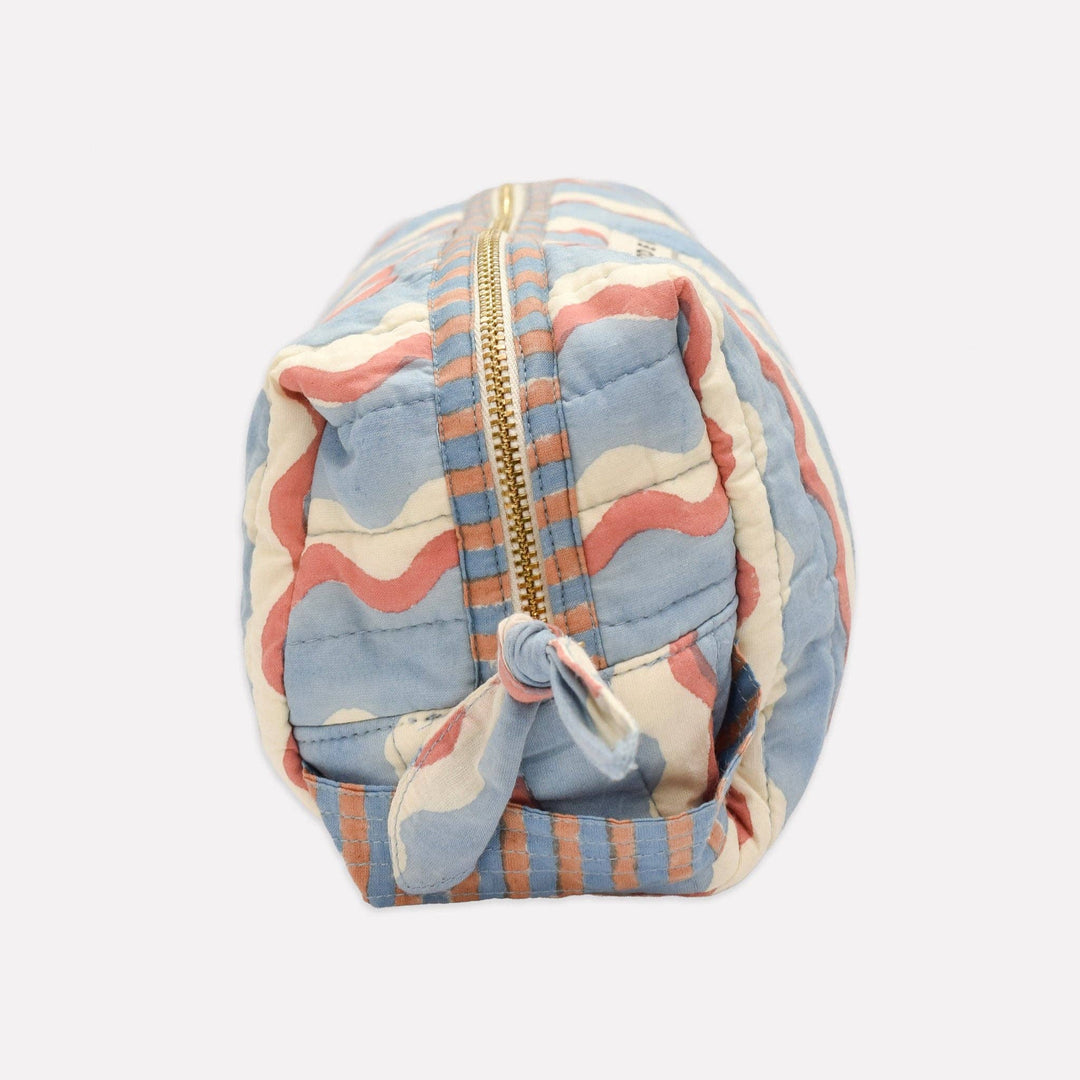 Multicolored quilted pouch with a zipper on a white background