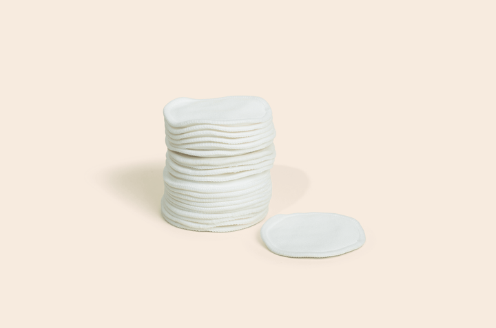 Stack of white bamboo rounds on a beige background