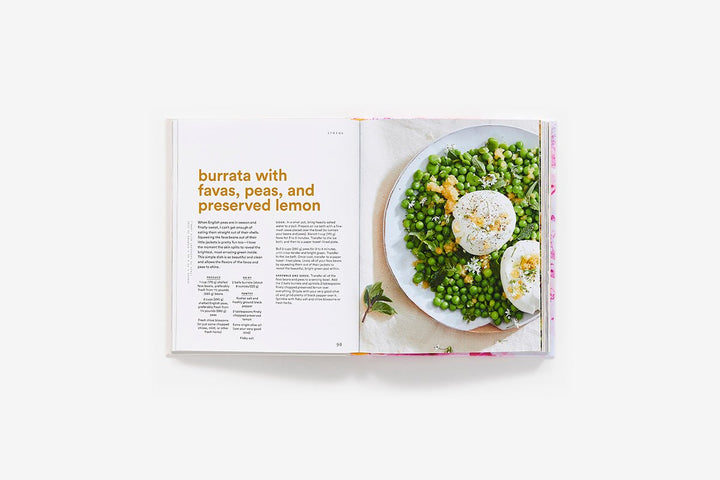 Open cookbook showing a recipe for burrata with favas, peas, and preserved lemon on a white background.