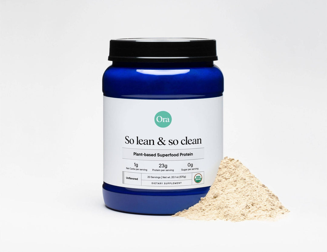Ora plant-based superfood protein powder container with a scoop of powder on a white background