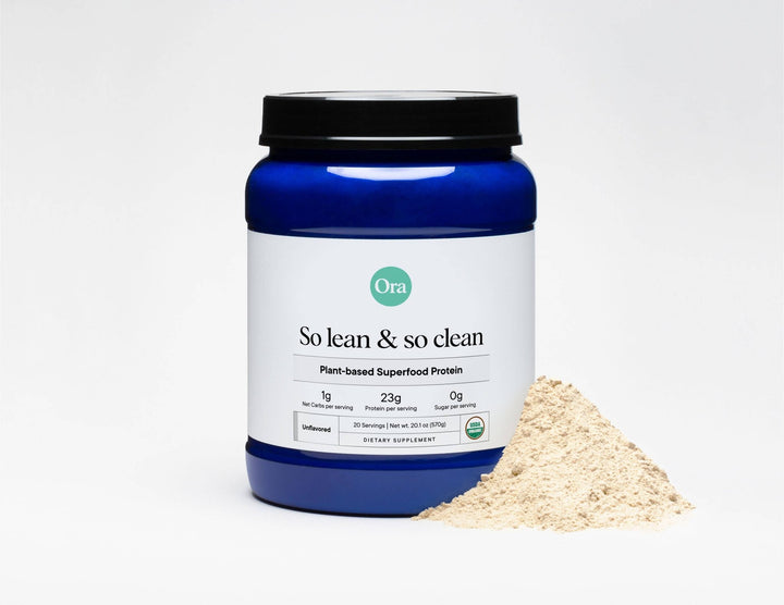Ora plant-based superfood protein powder container with a scoop of powder on a white background