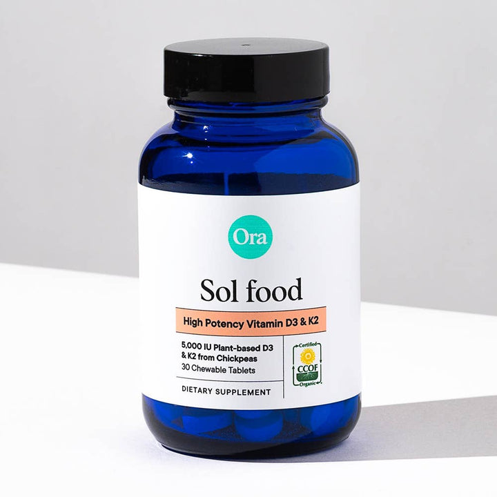 Blue supplement bottle labeled &