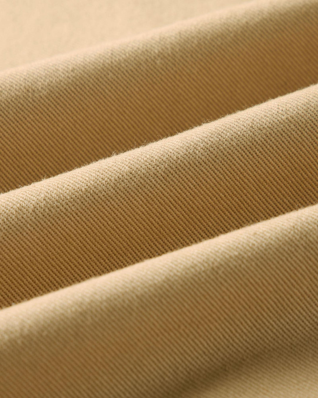 Close-up of beige fabric with a ribbed texture