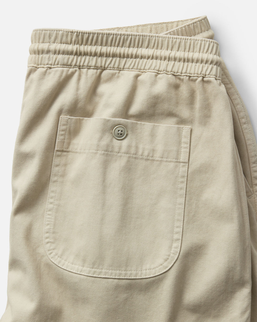 Taylor Stitch The Après Short in Organic Aged Stone Foundation Twill back button pocket on a white background